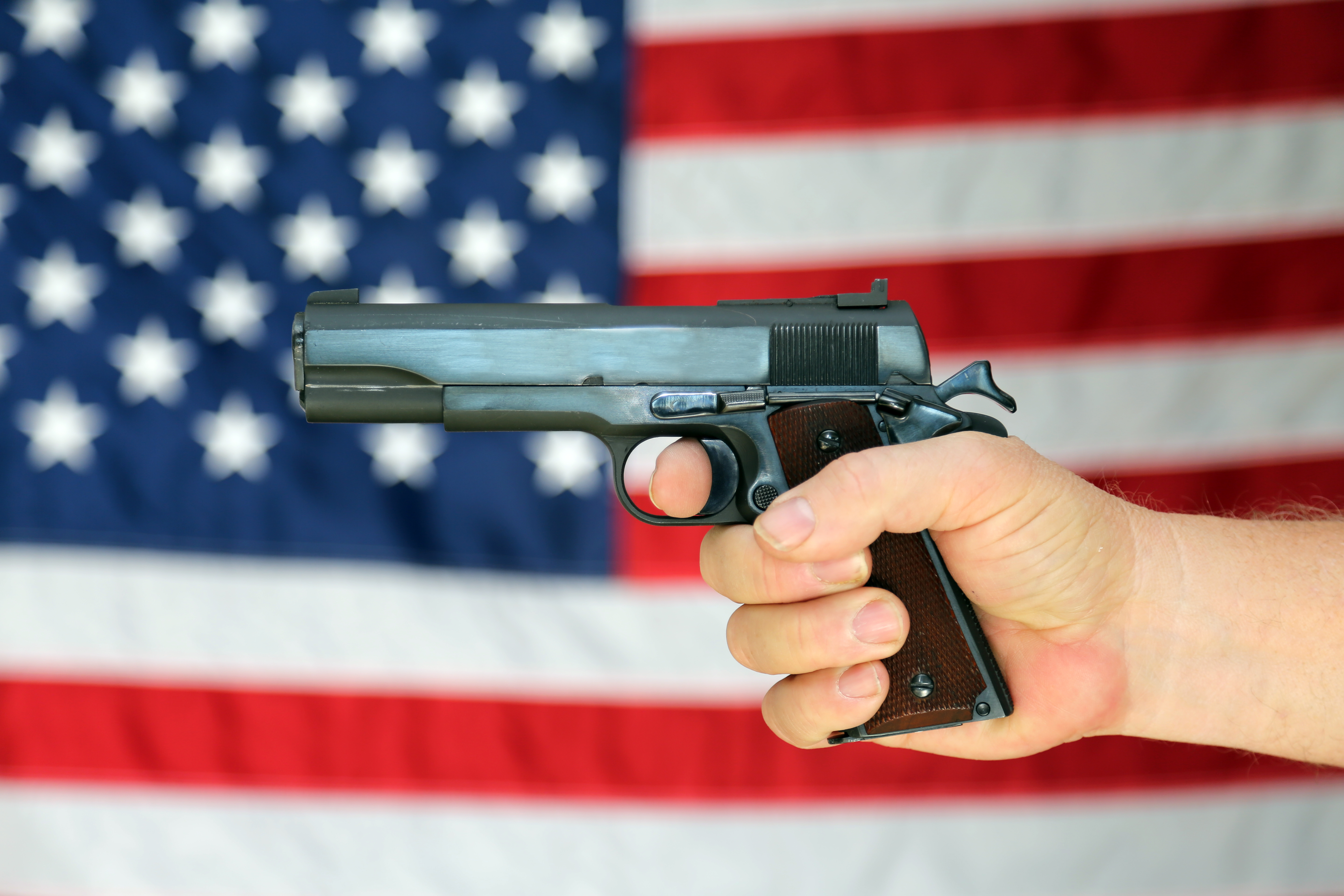 Gun in front of American flag